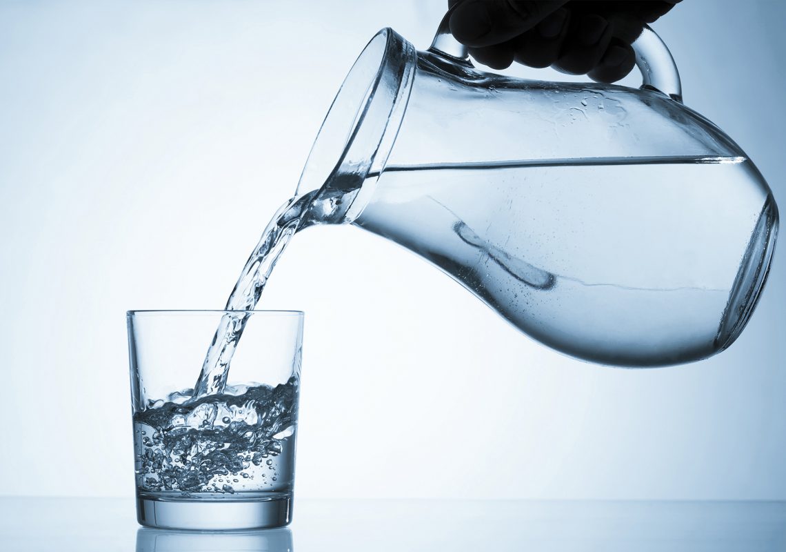 Pouring water into a glass.