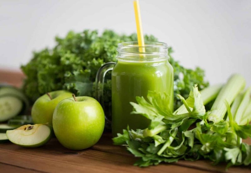 green-juice-on-table-with-vegetables (1)